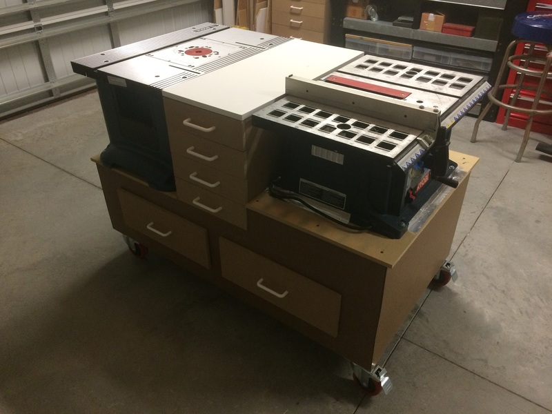 Workbench with integrated table saw and router table 